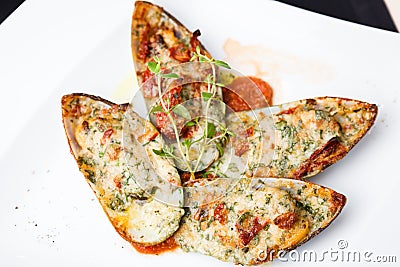 Baked mussels with parmigiano Stock Photo