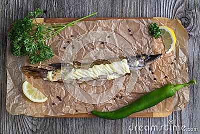 Baked pike wooden on the table Stock Photo