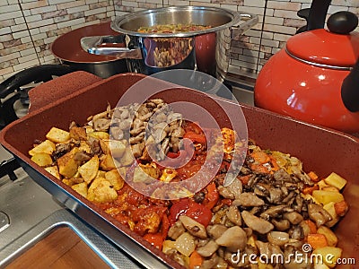 Fried vegetables - mushrooms, potatoes, zucchini Stock Photo