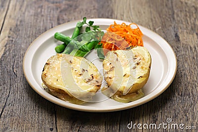 Baked potatoes with Munster cheese Stock Photo