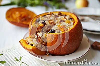 Baked Pumpkin with Rice and Fruits Stuffing Stock Photo