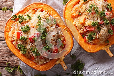 Baked pumpkin stuffed with couscous, meat and vegetables close-up Stock Photo