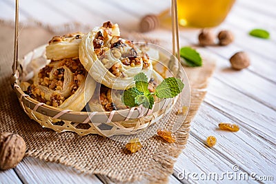 Baked rolls stuffed with walnuts, raisins and honey Stock Photo