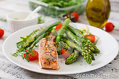 Baked salmon garnished with asparagus Stock Photo