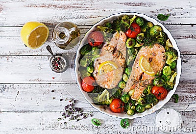 Baked salmon steak with vegetables. Stock Photo