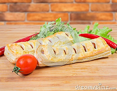 Baked sausage rolls with herbs and vegetables close-up Stock Photo