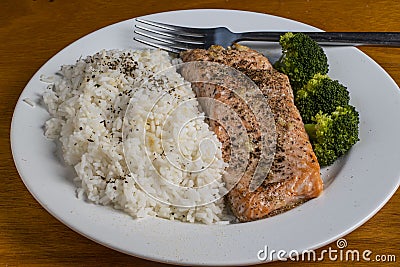 baked season salmon with rice and broccoli Stock Photo