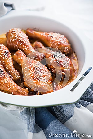 Baked spicy chicken legs with sesame Stock Photo