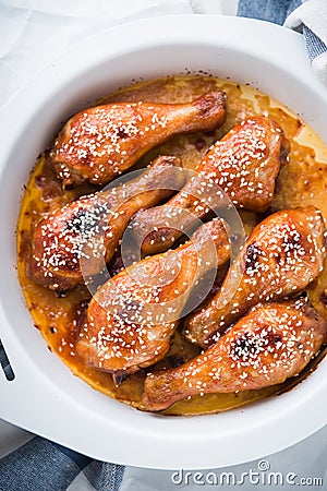 Baked spicy chicken legs with sesame Stock Photo
