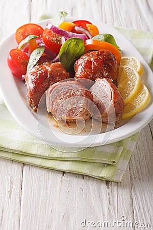 Baked spicy rabbit fillet and fresh salad of tomatoes, peppers, Stock Photo