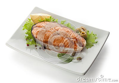 Baked steak of salmon with olives and lemon Stock Photo