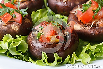 Baked stuffed portobello mushrooms on lettuce macro Stock Photo