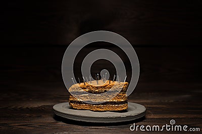 Baked sweet cake on a concrete plate on a dark wooden background. For diet advertising Stock Photo