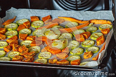 Baked sweet potato, zucchini and carrots Stock Photo