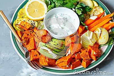 Baked sweet potato, zucchini and carrots Stock Photo