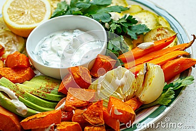 Baked sweet potato, zucchini and carrots Stock Photo