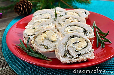 Baked turkey rolls with spinach, mozzarella on plate. Healthy tasty lunch. New Year and Christmas appetizer Stock Photo