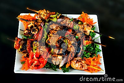 Baked whole chicken with oranges and potatoes on a plate. horizontal view from above Stock Photo