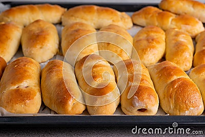 Baked yeast buns on a baking sheet Stock Photo