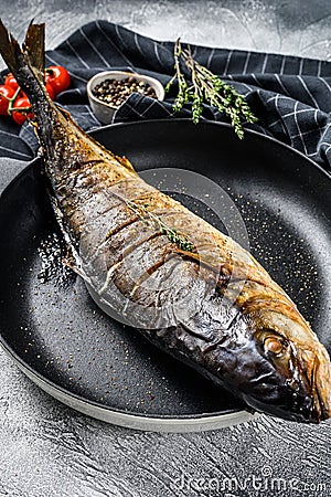 Baked Yellowtail, Japanese amberjack in a pan. Gray background. Top view Stock Photo