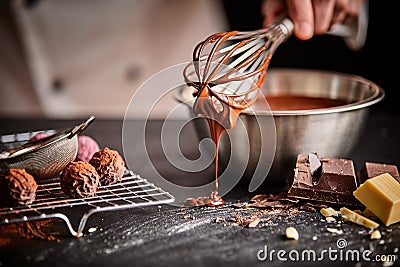 Baker or chocolatier preparing chocolate bonbons Stock Photo