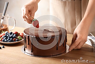 Baker decorating fresh delicious homemade chocolate Stock Photo