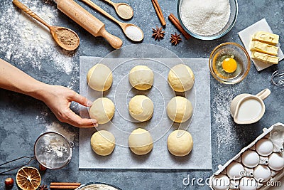 Baker hands preparing dough for buns recipe ingridients food flat lay Stock Photo