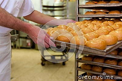 Baker in his bakery Stock Photo