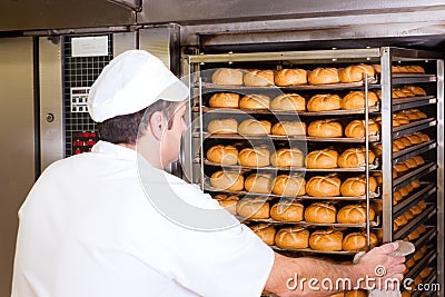 Baker in his bakery Stock Photo