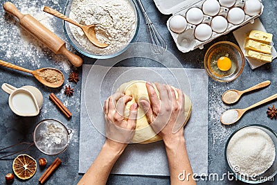 Baker knead dough bread, pizza or pie recipe ingridients with hands, food flat lay Stock Photo