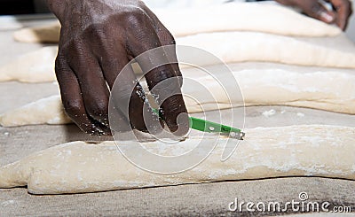 The baker prepares bread dough Stock Photo