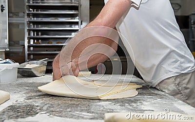 The baker prepares bread dough Stock Photo