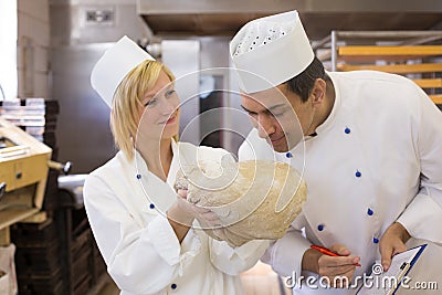 Baker smelling bread dough Stock Photo