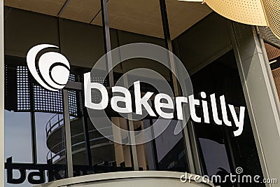 Baker Tilly logo sign above the entrance of the Bakertilly office. Editorial Stock Photo