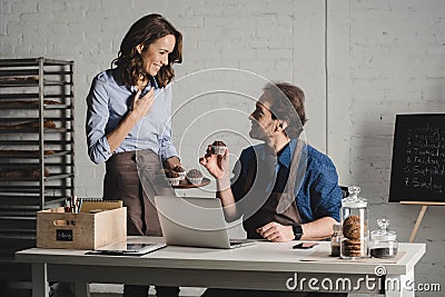 Bakers examining pastries Stock Photo