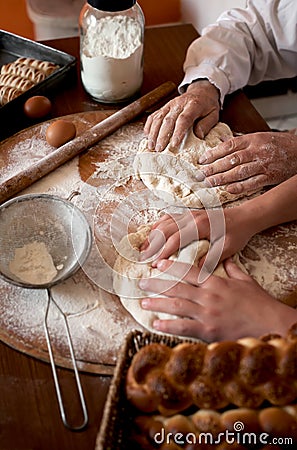 Bakers knead homemade fresh bread Stock Photo