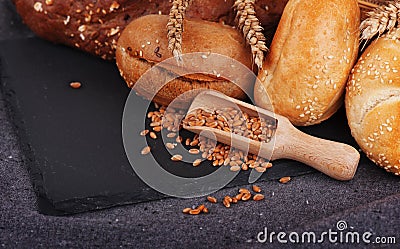 Bakery, crusty loaves of bread and buns. Assortment of baked bread. Stock Photo