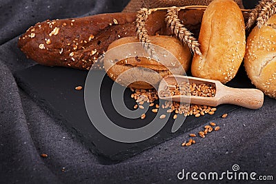 Bakery, crusty loaves of bread and buns. Assortment of baked bread. Stock Photo