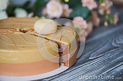 Bakery with piece of unusual yellow mousse cake with almond dacquoise, raspberry confit, crispy layer with caramelized Stock Photo