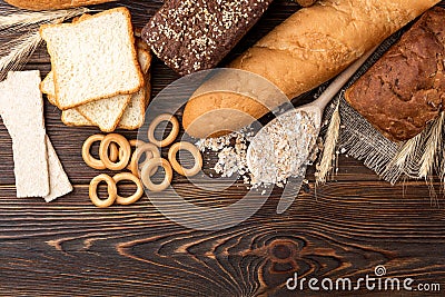 Bakery products on wooden. Baguette, toast bread, crispbreads and bread. Stock Photo