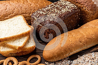 Bakery products on wooden. Baguette, toast bread, crispbreads and bread. Stock Photo