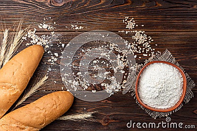 Bakery products on dark wooden. Baguette, toast bread, crispbreads and bread. Stock Photo