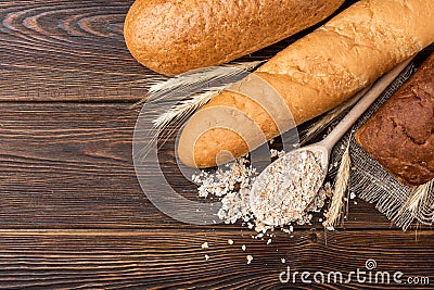 Bakery products on wooden. Baguette, toast bread, crispbreads and bread. Stock Photo