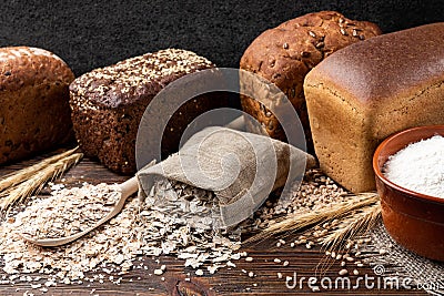 Bakery products on wooden. Baguette, toast bread, crispbreads and bread. Stock Photo