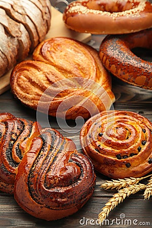 Bakery - various kinds of breadstuff. Bread rolls, bagel, sweet bun. Vertical photo Stock Photo