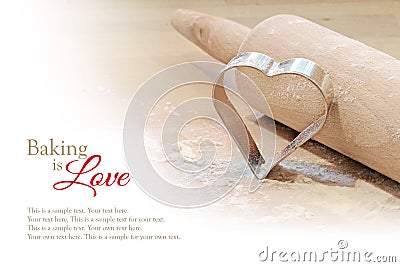 Baking background, heart cookie cutter and rolling pin Stock Photo