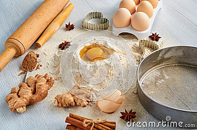 Baking background. Raw igredients for cake eggs, spices, flour and bakery supplies. Kitchen table Stock Photo