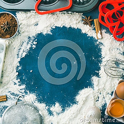 Baking flour frame on dark blue with tools ingredients Stock Photo