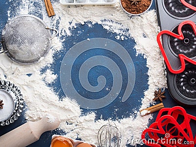 Baking flour frame on dark blue with tools ingredients Stock Photo