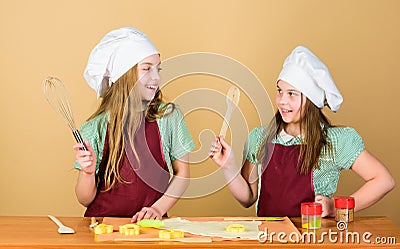 Baking ginger cookies. Girls sisters having fun ginger dough. Homemade cookies best. Kids baking cookies together. Kids Stock Photo